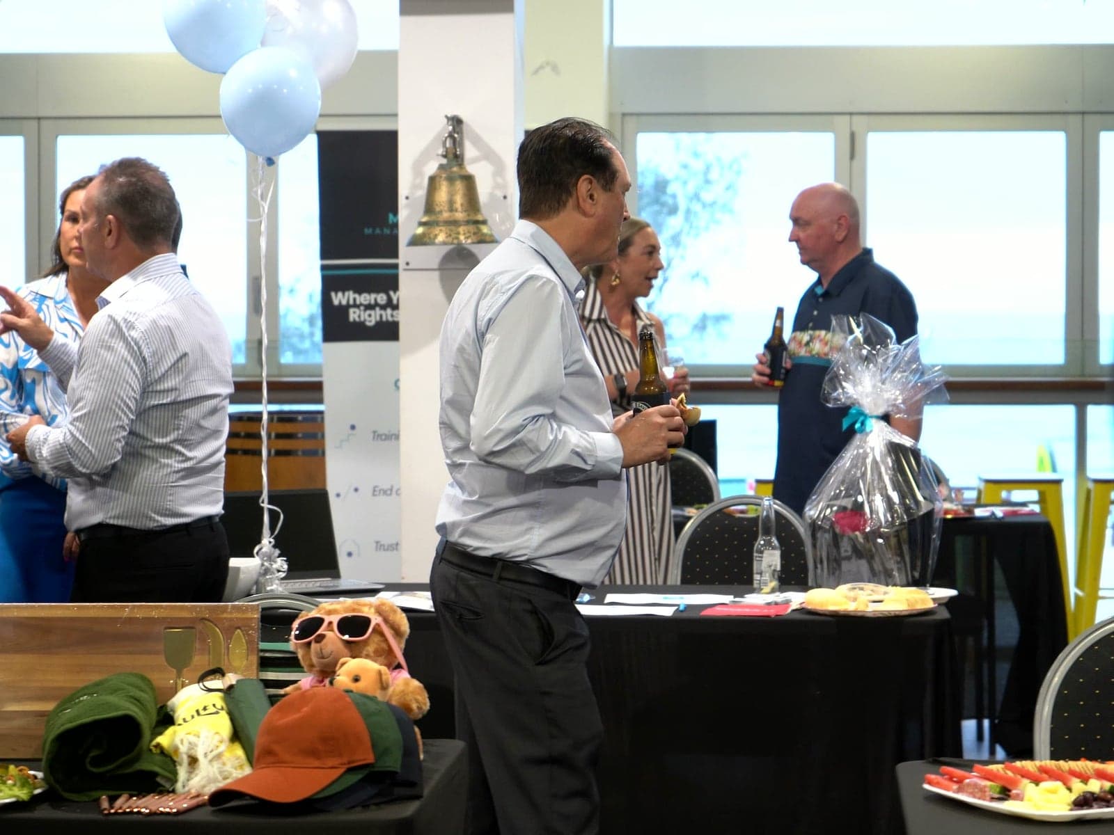 Exhibitors talking with guests at their stands.