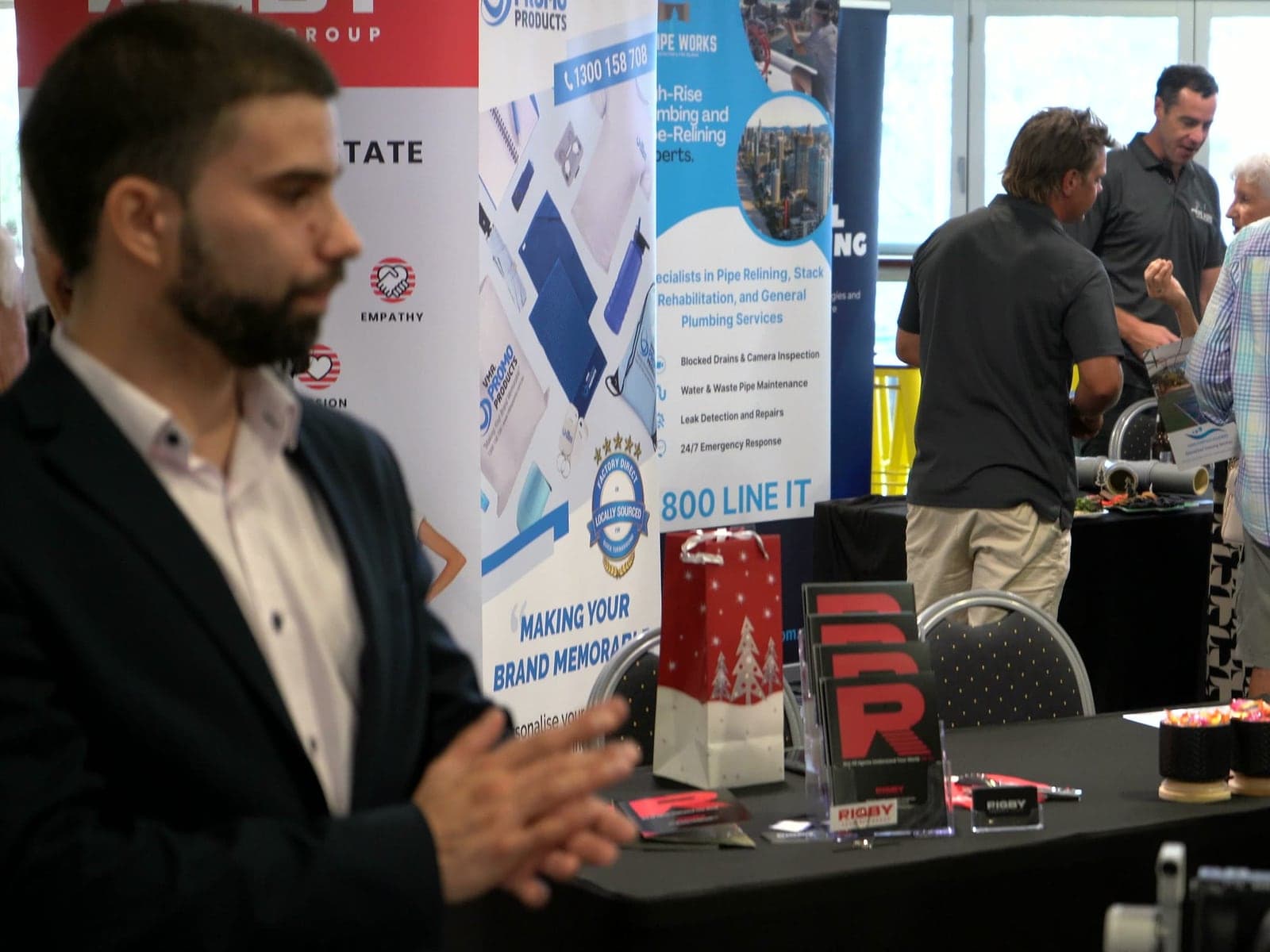 Two guests laughing during the networking hour.